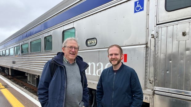 Feds confirm Via Rail will replace entire fleet of trains, no clarity on fixing N.B. tracks; Past President Ted Bartlett, \(left\), with Tim Hayman from Halifax, the current president of Transport Action Atlantic standing in front of an old Via Rail train dating around the mid 90s\.