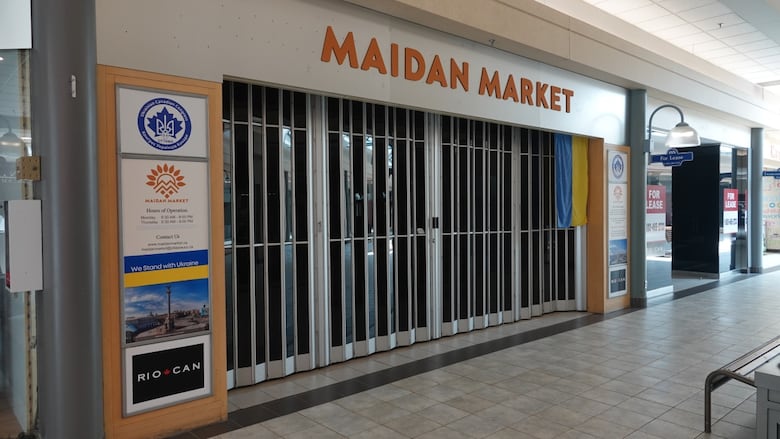 A closed storefront at a mall.