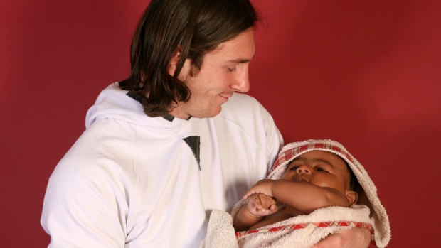 Photo of young Lionel Messi with Lamine Yamal as a baby goes viral; This photo taken in 2007 shows a 20-year-old Lionel Messi, who had embarked on his legendary Barcelona career just over four years prior, cradling Lamine Yamal, who was merely six months old at the time during a photo session in the dressing room of the Camp Nou stadium in Barcelona, Spain\. Lamine Yamal is now a soccer sensation\. 