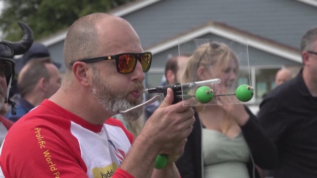 WATCH | Your front-row seat to the 2024 world pea shooting championships; Ready, set, shoot! Contestants from around the world gathered in Witcham, U\.K\., on July 13 to compete in the 2024 world pea shooting championships\. Competitors had to score as many points as possible while standing just shy of four metres from the target, which was shaped like a traditional dartboard\.