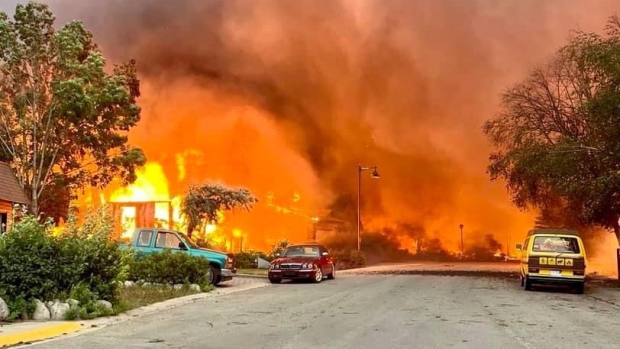 What's real? How CBC News verifies video and images; Properties are engulfed in flames at the corner of Cabin Creek Drive and Patricia Street in Jasper, Alta\., on Wednesday, July 24, 2024\. 