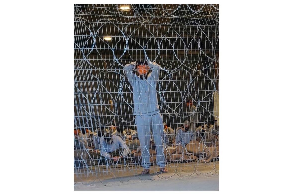 This undated photo taken in the winter of 2023 and provided by Breaking the Silence, a whistleblower group of former Israeli soldiers, shows blindfolded Palestinians captured in the Gaza Strip in a detention facility on the Sde Teiman military base in southern Israel. (Breaking The Silence/The Associated Press)