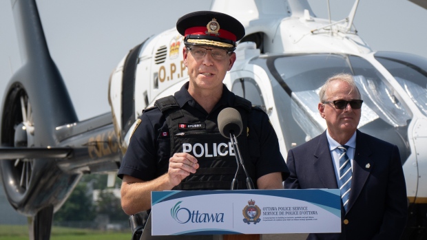 Ottawa police helicopter 'critical' resource, but will take a year to arrive; Ottawa Police Service Chief Eric Stubbs speaks at the Rockcliffe Airport on July 30, 2024, in front of an OPP helicopter\. A newer version of that helicopter will be used to assist officers trying to capture suspected vehicle thieves\.