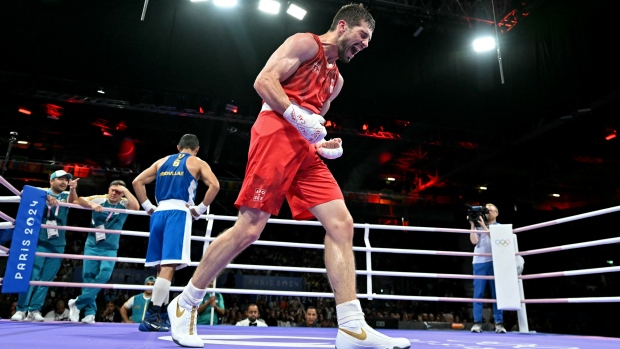 Canada's Wyatt Sanford guaranteed a boxing medal at Paris Olympics; Canada's Wyatt Sanford celebrates after winning against Uzbekistan's Ruslan Abdullaev in the men's 63\.5kg quarterfinal boxing match during the Paris 2024 Olympic Games at the North Paris Arena, in Villepinte on Thursday\.