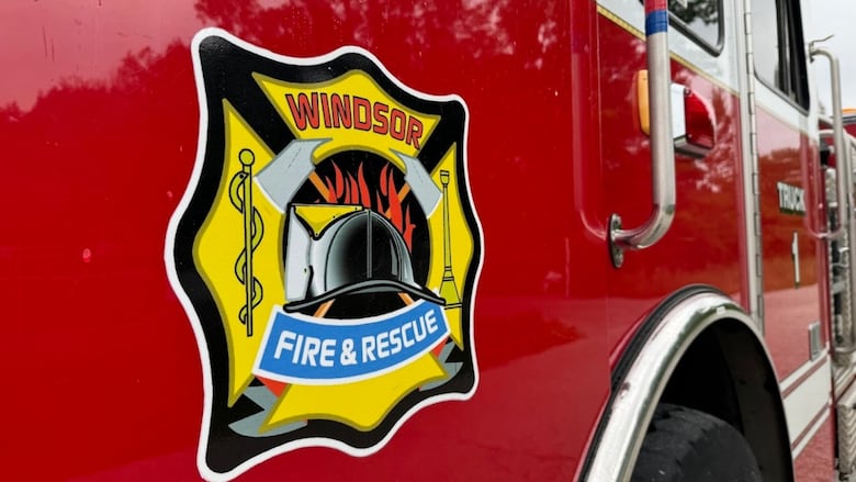 A logo on a red fire truck. 
