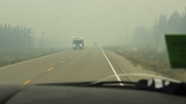 'Essential' water pumps allegedly stolen from N.W.T. fire crews; Smoky skies seen on Highway 1, south of Fort Providence, on Aug 11, 2024\.