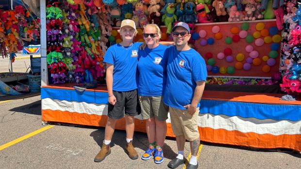 P.E.I. family working at Old Home Week aren't your old-style carnies; Jace Collins, Kayla Harvie and Steve Arsenault\.