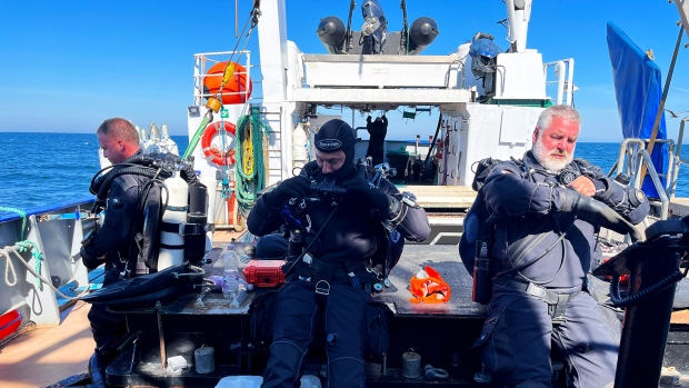 How did divers manage to blow up the Nord Stream pipeline? We went down to the spot to find out; Three divers stand on a diving vessel chartered by German broadcaster ARD to find out where the Nord Stream pipeline in the Baltic Sea was attacked\.