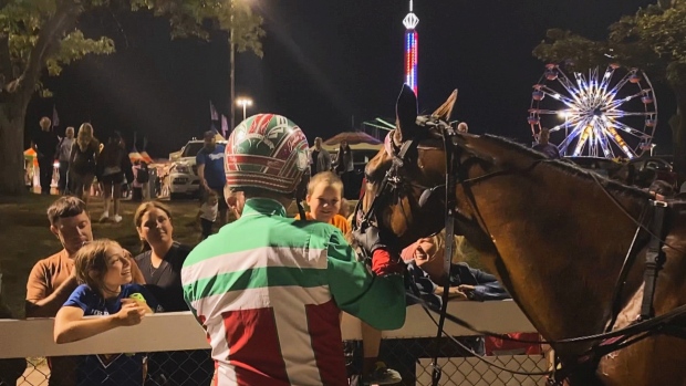 Covered Bridge wins Gold Cup and Saucer for 2nd year in a row; Covered Bridge, with driver Jordan Stratton, is congratulated by fans after winning the 65th Gold Cup and Saucer Saturday night at the Charlottetown Driving Park at Red Shores\.