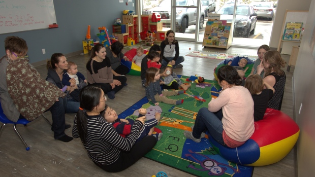 As more Albertans turn to free family and community programs, operators say funding hasn't kept up; Parents and young children participate in a literacy program run by the Family Futures Resource Network in Edmonton\. Family resource networks have seen a recent surge in participants\.