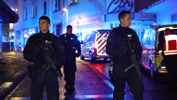 ISIS claims responsibility for fatal knife attack at German festival; suspect arrested after manhunt; Police and ambulances near the scene where people were killed and injured in an attack at a festival in Solingen, western Germany, the German dpa news agency reported, Friday, Aug\. 23, 2024\. 