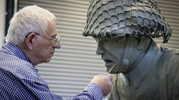 'Perfect is good enough': Husband and wife sculptors reflect on 54 years working together; Bronze sculptor Don Begg, makes adjustments to an eight-foot bronze statue depicting a World War II Canadian soldier, will be receiving the Alberta Order of Excellence for his work over the decades and is pictured in his workshop in Cochrane, Alta\. 
