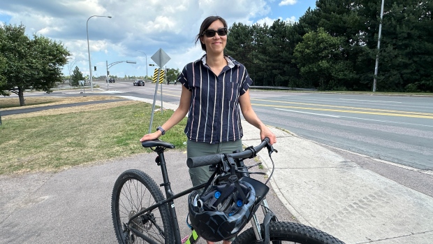 Moncton changing intersection to improve safety near where cyclists struck; Leslie Tse, Moncton's active transportation coordinator, standing along Connaught Avenue on Aug\. 27, 2024\.