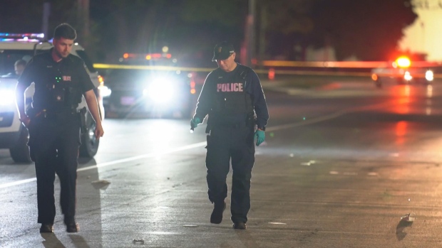 3 men shot, 1 woman stabbed in Mississauga: police; Police officers seen walking on a blocked off stretch of a street\.