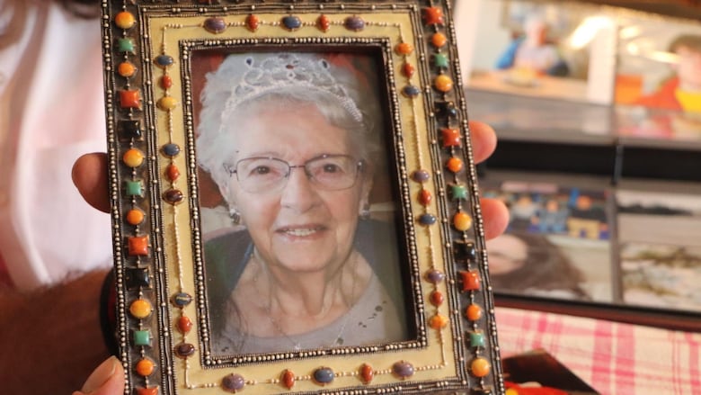 A framed photo of an elderly woman wearing a tiara