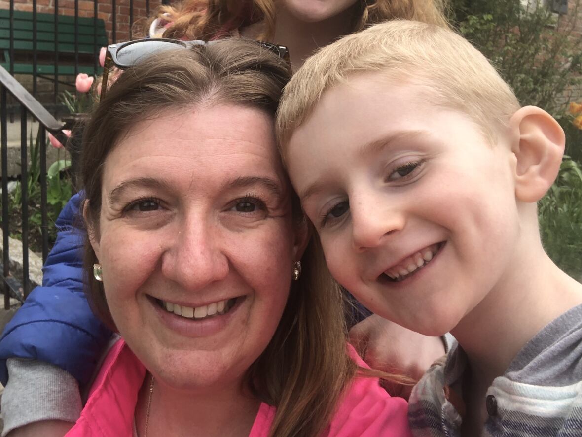 Kate Dupuis and her young son, Alexander, broadside  by side. 