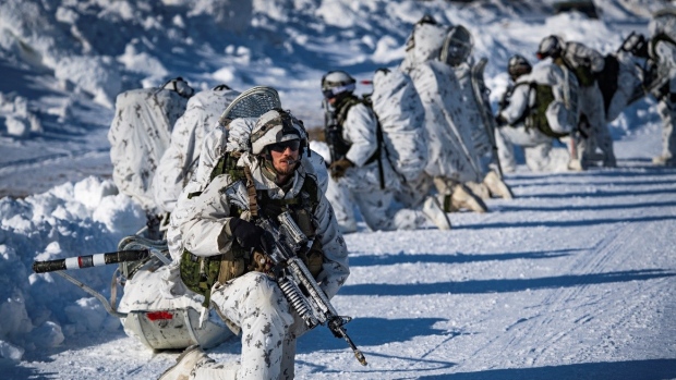 Canadian Army says new military sleeping bags not suitable for 'typical Canadian winter'; Canadian Army soldiers from 3rd Battalion, Royal 22e Régiment, prepare to move out from a landing area after disembarking from a CH-147 Chinook helicopter in the training area of Fort Greely, Alaska, United States, during training at the Joint Pacific Multinational Readiness Center on March 16, 2022\.