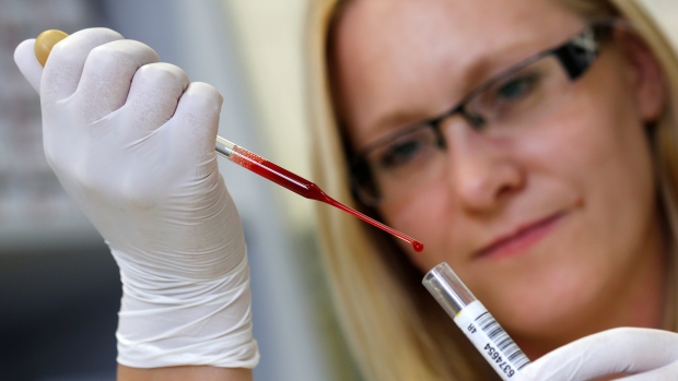 How redefining 'normal' iron levels could help women's health; A laboratory technician tests donor blood in the 'Bayerisches Rotes Kreuz' blood transfusion service laboratory in Munich, Germany, September 5, 2016\. 