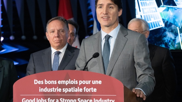 Trudeau says Singh, NDP 'caved' to political pressure in fight against climate change; Prime Minister Justin Trudeau and Quebec Premier Francois Legault, left, make an aerospace announcement at the MDA satellite manufacturing centre on Friday, September 13, 2024 in Ste\.Anne-de-Bellevue, Quebec\.