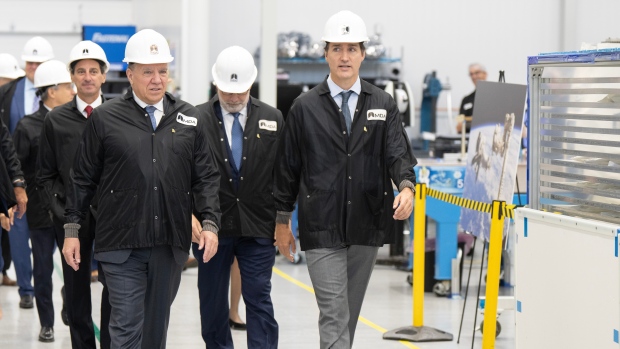 Ottawa, Quebec pool $2.5B to build satellites for better internet in remote areas; Prime Minister Justin Trudeau and Quebec Premier François Legault tour the MDA satellite manufacturing centre, which is located in Saint-Anne-de-Bellevue, Que\.