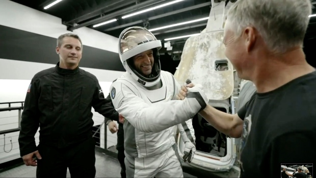 SpaceX private spacewalk crew returns to Earth; In this image made from SpaceX video, tech entrepreneur Jared Isaacman, center, greets as he gets out of its capsule upon his return with his crew after the capsule landed in the Gulf of Mexico near Florida's Dry Tortugas early Sunday, Sept\. 15, 2024\. \(SpaceX via AP\)