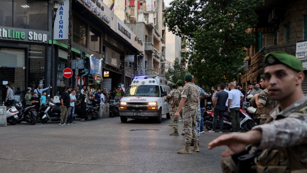 Taiwan's Gold Apollo says it did not make pagers used in Lebanon blasts; Lebanese army soldiers stand guard as an ambulance rushes wounded people to a hospital in Beirut on September 17, 2024, after explosions hit locations in several Hezbollah strongholds around Lebanon amid ongoing cross-border tensions between Israel and Hezbollah fighters\. Hundreds of people were wounded when Hezbollah members' paging devices exploded simultaneously across Lebanon on September 17, in what a source close to the militant movement said was an "Israeli breach" of its communications\. 