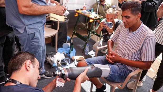 Gaza man's 'soul returned to life' upon getting new prosthetic leg; TOPSHOT - A man with an above-the-knee amputation is fitted with a new prosthetic limb at the Jordanian field hospital in Khan Yunis in the southern Gaza Strip on September 17, 2024 amid the ongoing war in the Palestinian territory between Israel and Hamas\. \(Photo by Bashar TALEB / AFP\) \(Photo by BASHAR TALEB/AFP via Getty Images\)