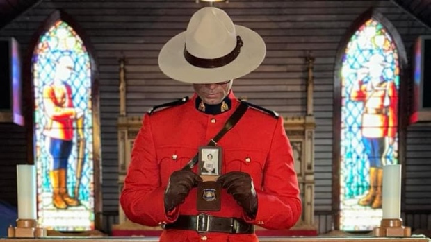 Newfoundland man whose mother was murdered becomes an RCMP officer; Daniel Benoit, in his RCMP ceremonial dress uniform, holds his mother's photo close to his heart\.