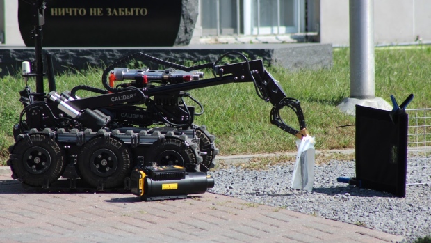 Bomb disposal unit called to Russian Embassy; An Ottawa police bomb disposal robot handles a suspicious package that Ottawa police say was tossed over the fence of the Russian Embassy on Charlotte Street late Friday morning\. Ottawa police said the object, and others, were safely removed and an investigation is ongoing\.