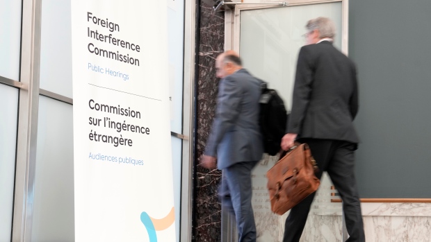 Former parliamentarian worked on behalf of foreign government to influence Parliament: CSIS; Lawyers enter the hearing room as the Public Inquiry into Foreign Election Interference resumes in Ottawa, Monday, Sept\. 16, 2024\.