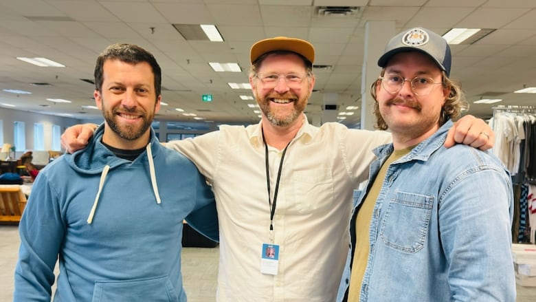 Three men standing together