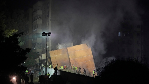 Ottawa reserving commercial airline seats to get Canadians out of Lebanon; Rescuers arrive at the site of an Israeli airstrike in Beirut's southern suburbs on Friday, Sept\. 27, 2024\.