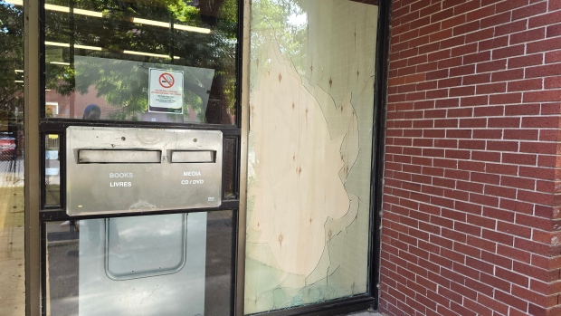 Suspect in Fredericton library vandalism arrested, faces 3 charges; A broken window, now boarded up, appeared to be the entry point for the people who vandalized the interior of the Fredericton Public Library\. 