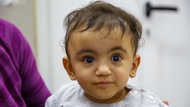 14-month-old lives in East Jerusalem hospital while parents shelter in Gaza; Sa'ida Idris is fed her lunch by a volunteer at the Al Makassed hospital in East Jerusalem\. The 14 month old has spent her entire life living in the hospital and being raised by staff and volunteers while her parents are in Gaza\. 
