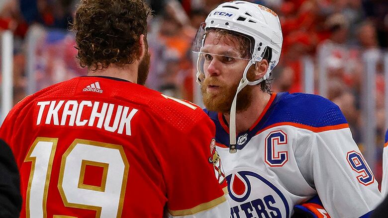 Connor McDavid of the Edmonton Oilers and the Florida Panthers' Matthew Tkachuk meet at centre ice after Game 7 of the Stanley Cup final at the Amerant Bank Arena on June 24, 2024 in Sunrise, Florida.