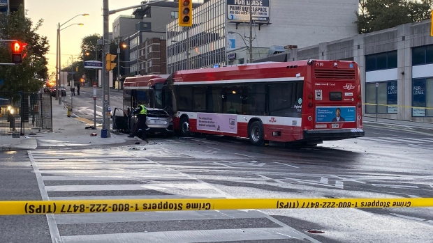 TTC bus driver pulls man from burning, possibly stolen car after crash; The scene of the crash early Wednesday\.