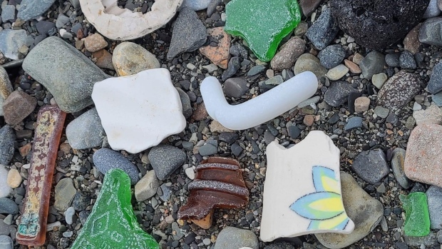 Woman in Ulukhaktok, N.W.T., collects thousands of pieces of sea glass on Arctic beach; Helena Ekootak says her favourite pieces are those with primary colours and with designs\. 