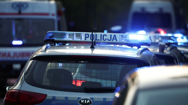 Poland arrests 4 in plot to mail explosives to Canada and U.S.; A police vehicle is parked in Warsaw, Poland, April 11, 2024\. Polish authorities have arrested four people in connection with an alleged plot to send explosives to Canada and the United States\.
