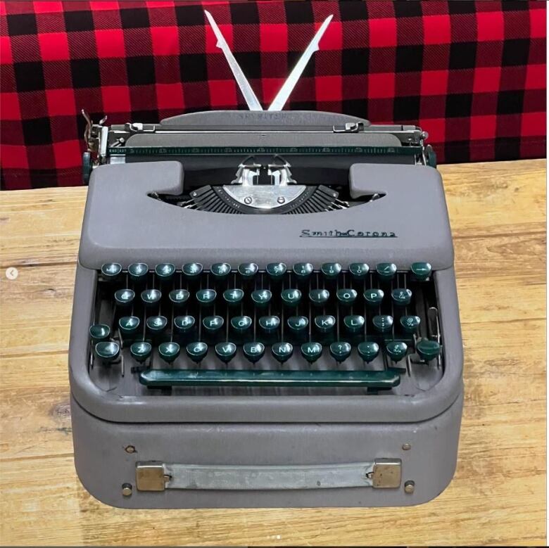 A vintage typewriter is shown.