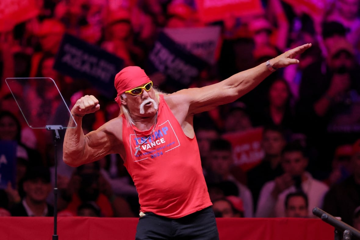 Hulk Hogan on stage and flexing for the crowd, during a campaign rally for Donald Trump.