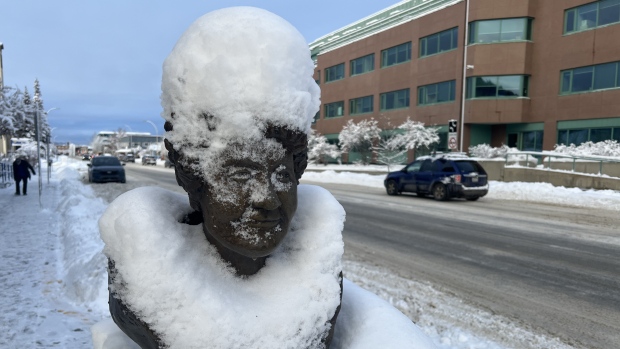 Whitehorse digs out after another heavy dump of October snow; A bust of Martha Black on Whitehorse's Fourth Avenue after a snowstorm\.