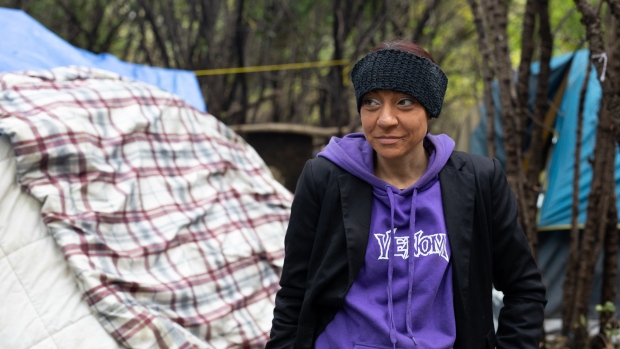 A night searching for Ottawa's hardest-to-reach homeless; Julie Voltolina in the camp she's built near Hurdman station\. It includes a guest tent, a kitchen tent and a bedroom tent\.