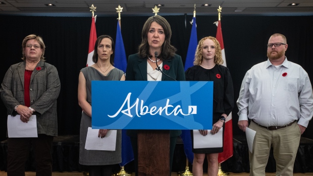 Alberta ban on trans women in female sports advances as athletic association questions need; Alberta Premier Danielle Smith speaks about introducing three new bills to do with transgender issues in Edmonton on Thursday, Oct\. 31, 2024\. She was joined by supporters of the new legislation, including 18-year-old Hannah Pilling standing second from the right\.