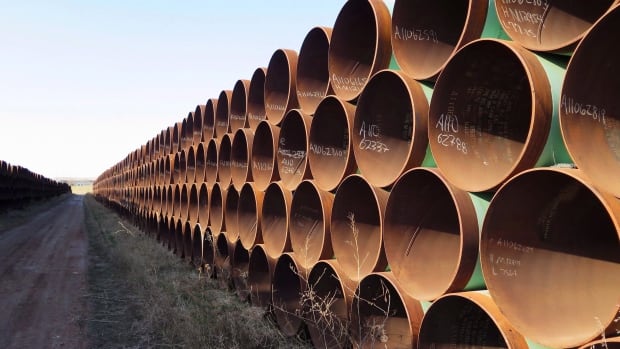 Pipes intended for construction of the Keystone XL pipeline are shown in Gascoyne, N.D. on Wednesday April 22, 2015. Cylindrical pipes are shown in a photo along a plain of grass.