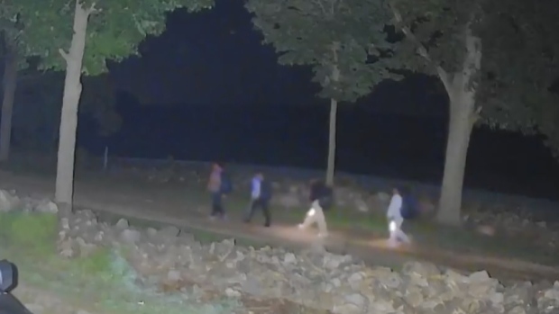 Sixteen caught crossing illegally into U.S. from Quebec in days before Trump tariff threat; A security camera installed by a Fort Covington, NY, area famer catches a group of people who crossed illegally into the U\.S\. from Canada on Aug\. 27, 2024\.