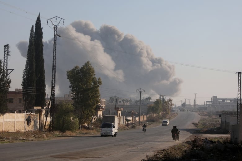 Smoke rises on the outskirts of Aleppo, Syria, as fighting between rebels and government forces continues on Friday.