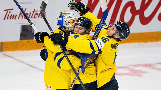Swedes hang on for win over resilient Latvians, advance to world junior semifinals; Sweden, which topped Group B in the preliminary round with a 4-0 record, is looking for its first world junior hockey title since 2012\.