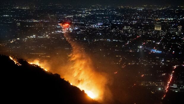 At least 5 dead in wildfires raging through L.A., destroying nearly 2,000 structures