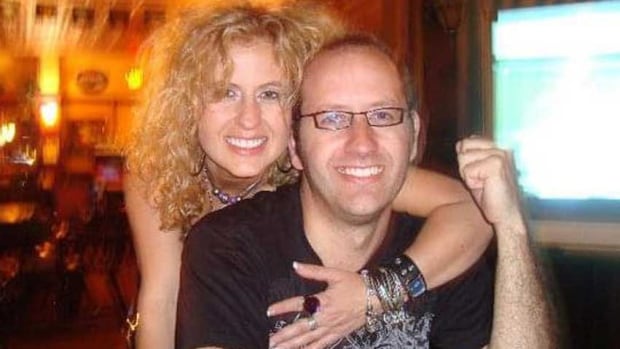 Erinn-Jane Brawn described her younger brother Matthew as a 'really good guy' who would 'do anything for anybody.' A smiling woman with curly, blond hair hugging a smiling man with short brown hair and glasses, from behind.