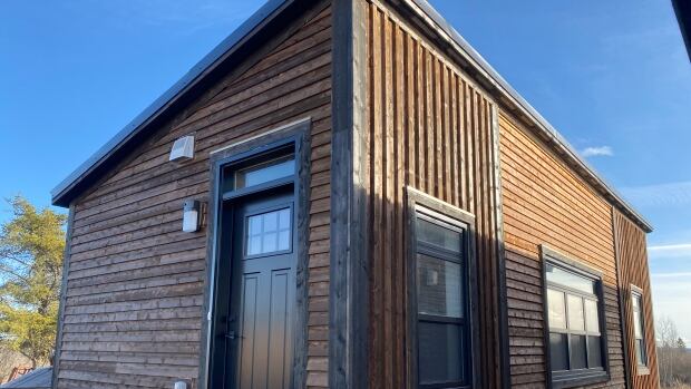 Emilie McBride submitted a building permit application, but was denied because of a Town of Sackville bylaw requiring dwellings to be 20 feet by 20 feet. She took this photo of a modular home — the same model she was purchasing, which is 36 feet long by 14 feet wide. A long, but narrow wooden home.